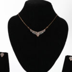 Elegant real Gold diamond mangalsutra set with matching earrings.